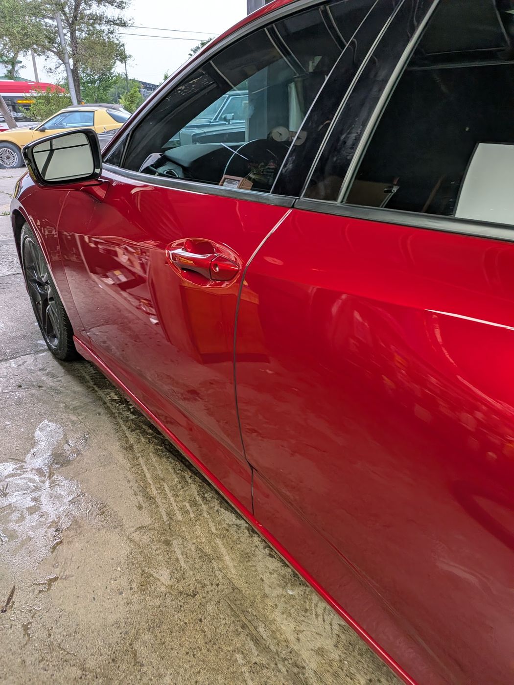 Red Acura TLX side profile, hand washed and glossed
